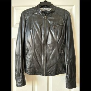 Lambskin leather jacket with zipper details, quilted shoulder detail. Never worn